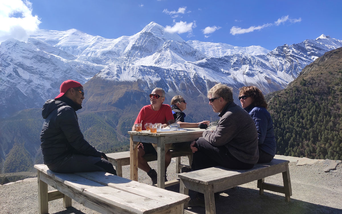 Enjoying hot tea under the mighty Gangapurna