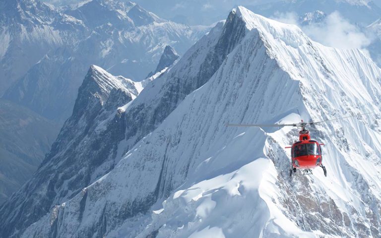 Helicopter flying over Himalayas