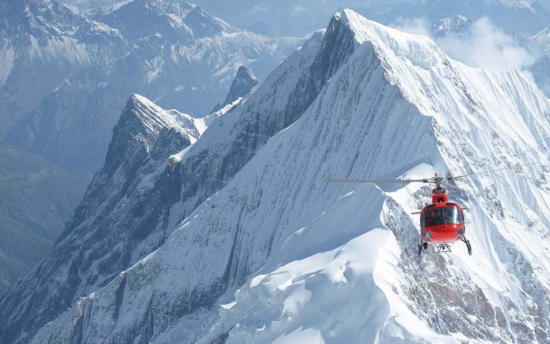 Helicopter flying over the Himalayas