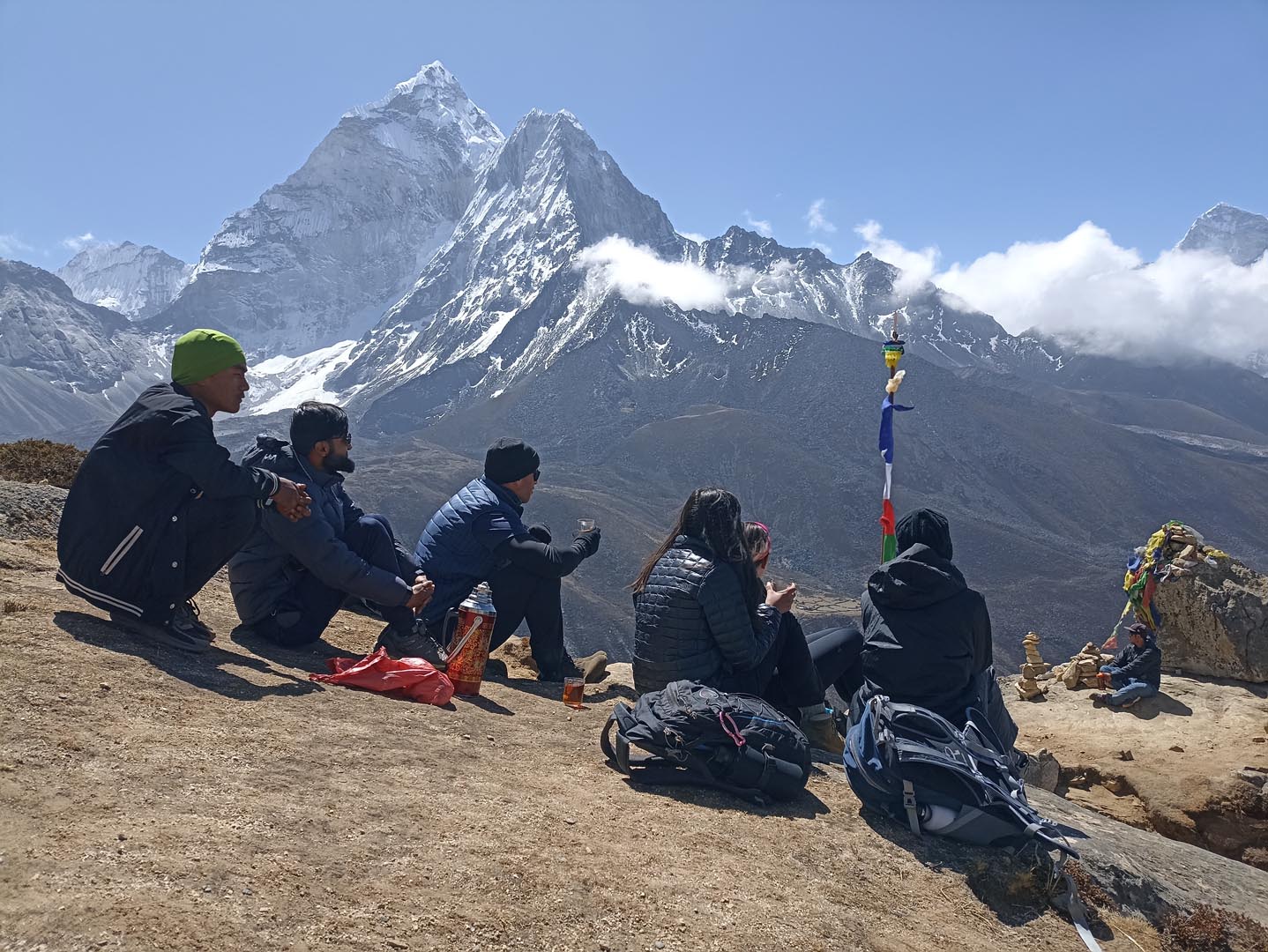 Trekkers enjoying hot tea during Dingboche acclimatization hike to Nangkartsang peak