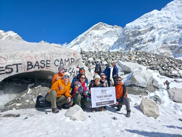 Trekkers capture a memorable moment at iconic Everest Base Camp.