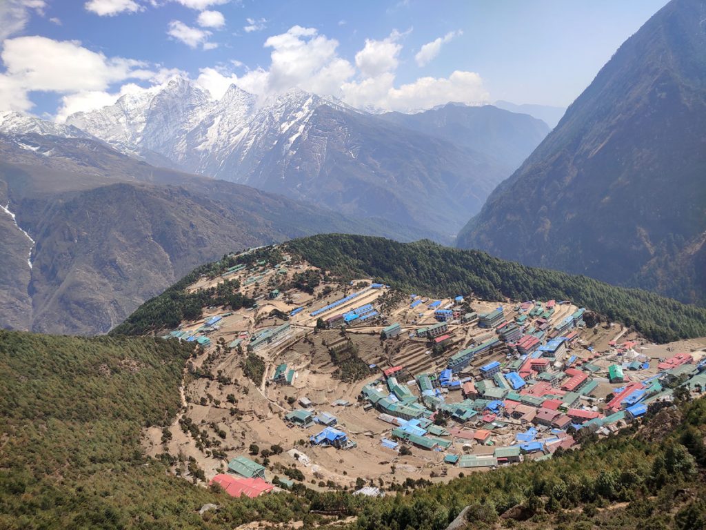 A birds eye view of Namche Bazaar with mountains in background