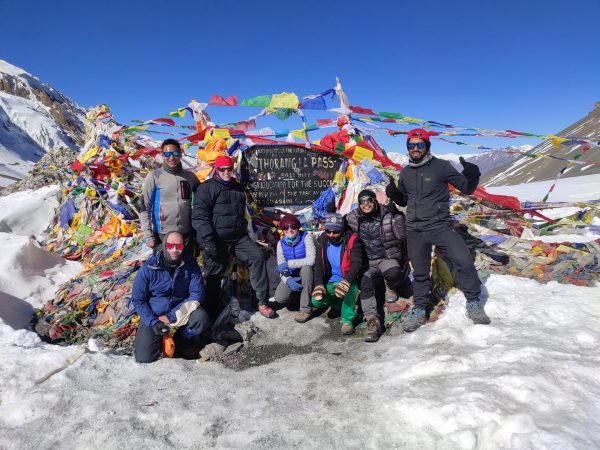 Trekkers at Thorongla Pass, highest point of Annapurna Circuit