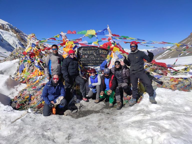 Trekkers at Thorongla Pass, highest point of Annapurna Circuit