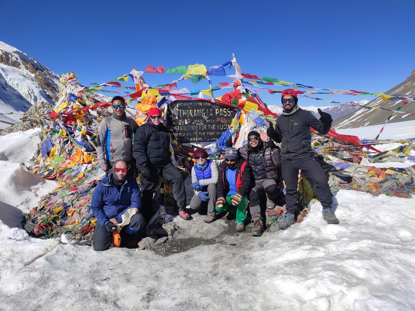 When is the Best Time for Annapurna Circuit Trek 14 Trekkers at Thorongla Pass, highest point of Annapurna Circuit