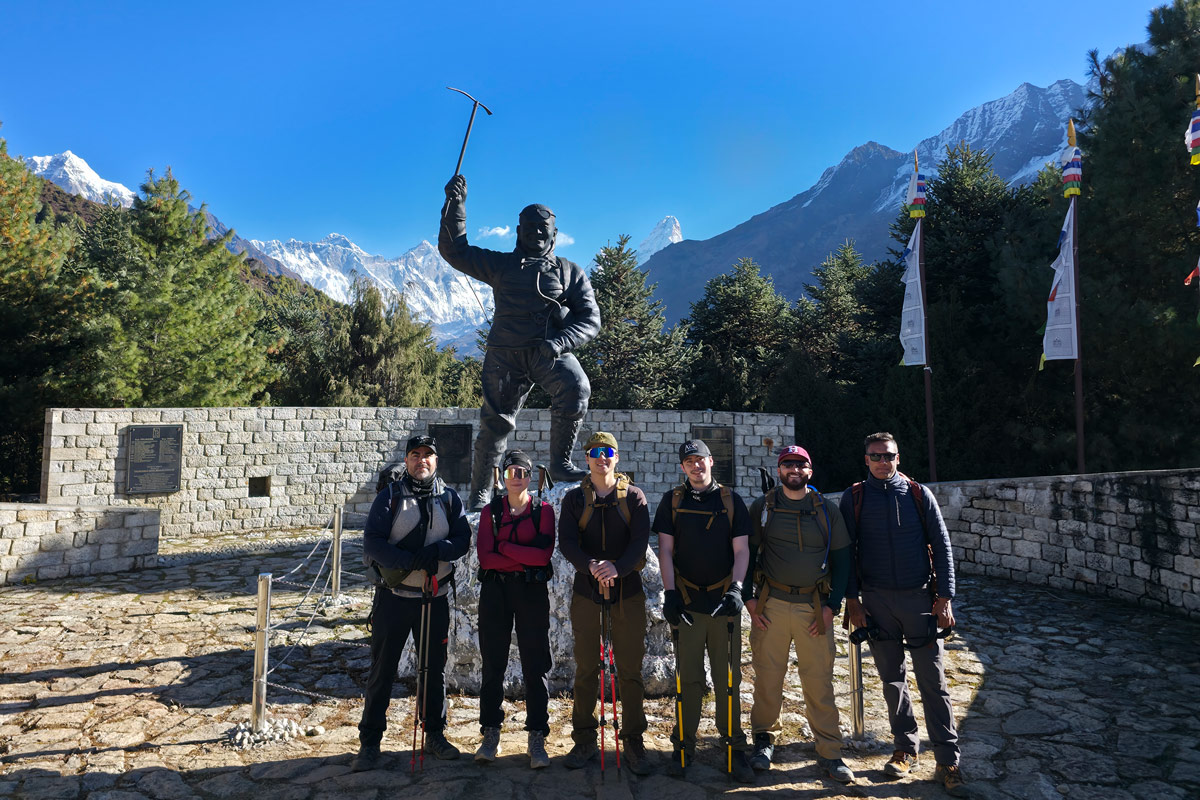 Trekkers visiting the Tenzing Hillary Statue at Namche Bazaar Viewpoint on the Everest Base Camp Trek Trekkers visiting the Tenzing Hillary Statue at Namche Bazaar Viewpoint on the Everest Base Camp Trek