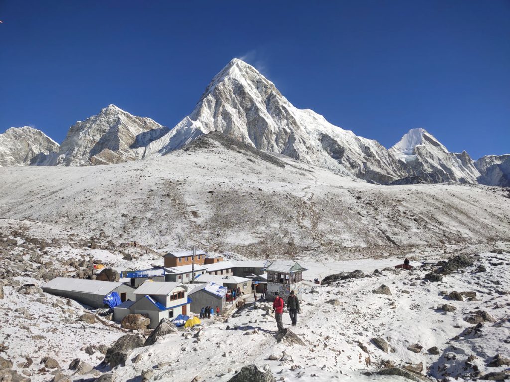 Snow blanketed view of Gorakshep with Mt Pumori