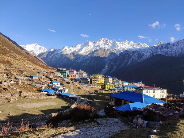 Kyanjin Gompa village with mountains in the background