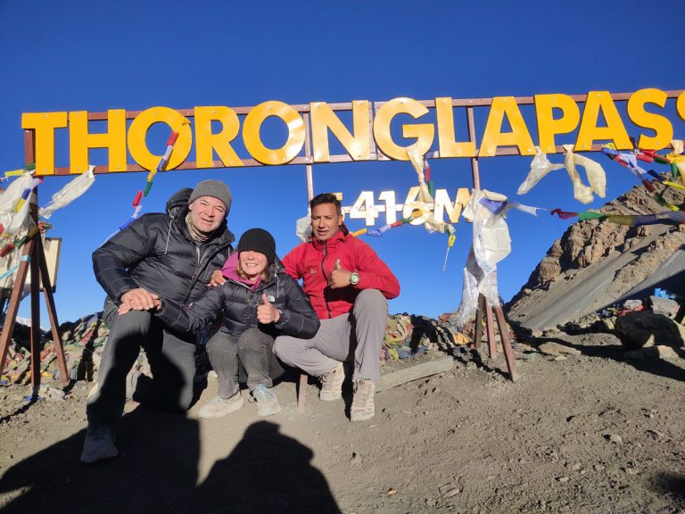 Trekkers posing at Thorong La Pass