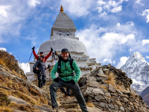 Pure excitement on the EBC trail with Amadablam and a stupa in view.