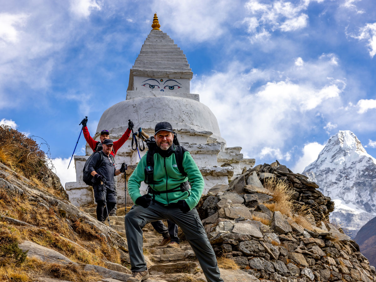Pure excitement on the EBC trail with Amadablam and a stupa in view.