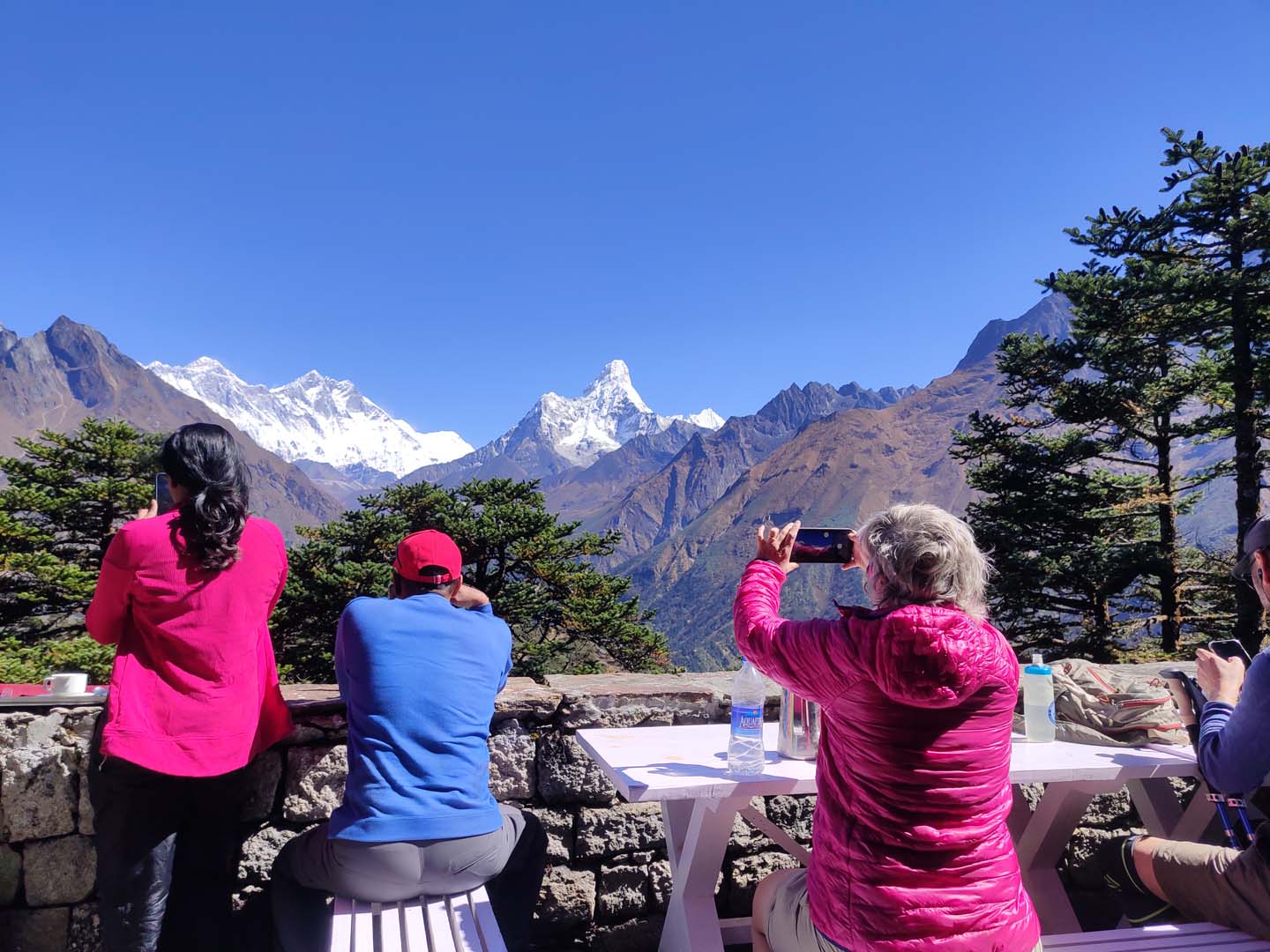 Trekkers enjoying mountain views from Hotel Everest View