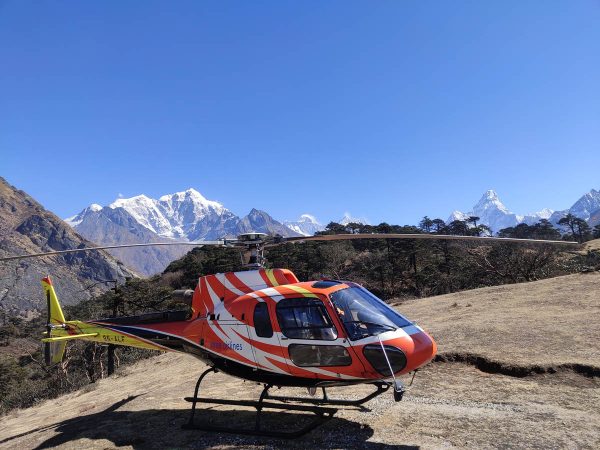 Helicopter landing at Hotel Everest View on a clear day