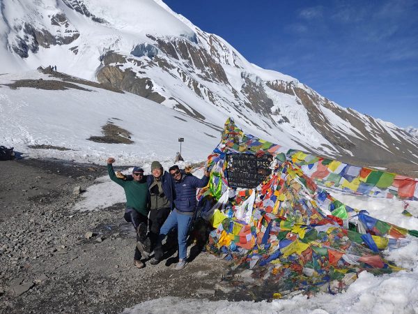 Posing for photo at Thorong La Pass