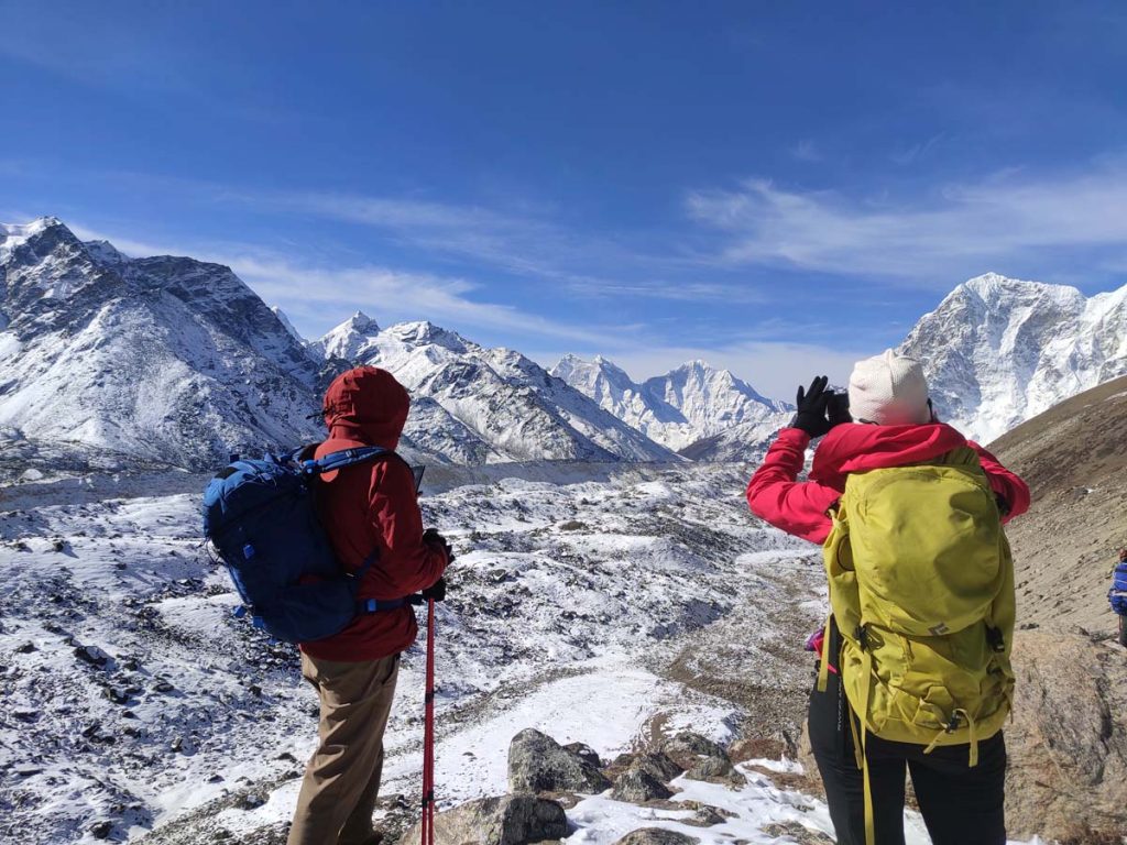 Elevation Gain during Everest Base Camp Trek 7 Trekkers enjoying views from Lobuche pass