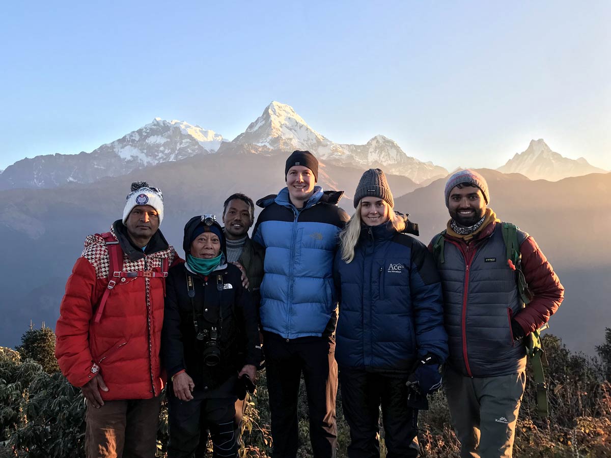A group of trekkers enjoying the stunning sunrise at Poonhill during the early morning on the Annapurna Base Camp trek.