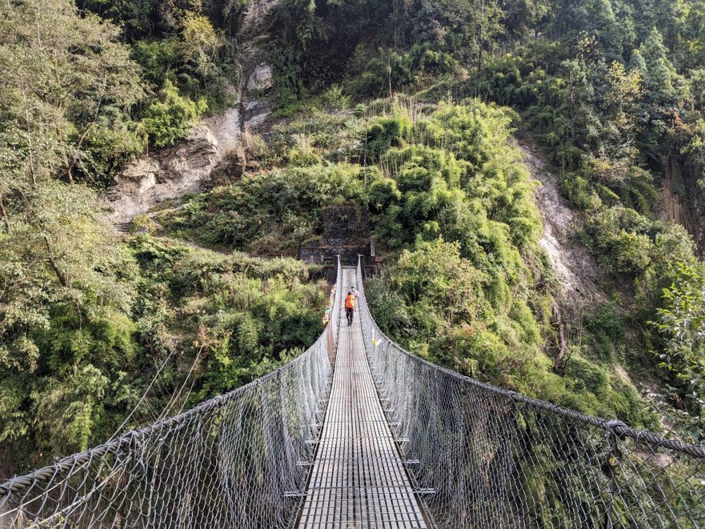 Crossing suspension bridge along the ABC trek route