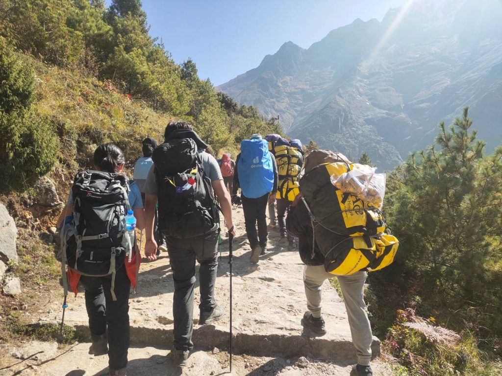 Trekkers and porters on Everest Base Camp trail