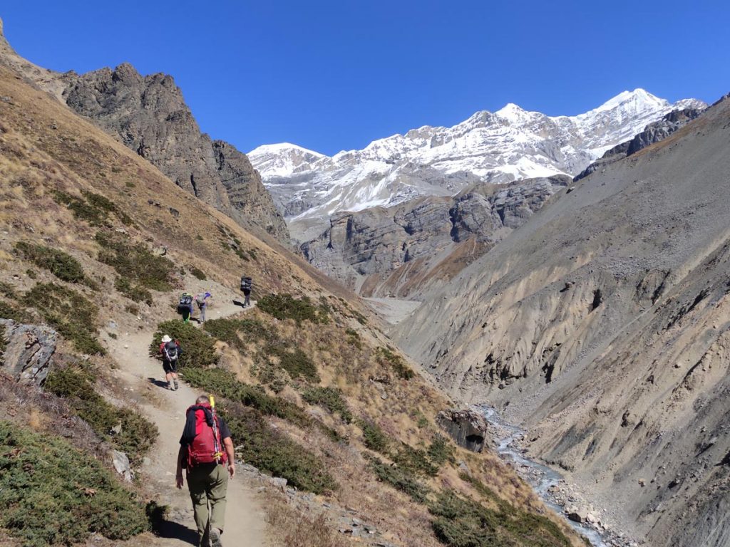 Trekker on the way to Thorang Phedi from Yak Kharka, Annapurna Circuit
