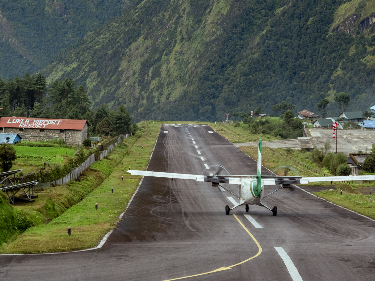 Everest Base Camp Trek in May 1 Airplane taking off from Lukla Airport