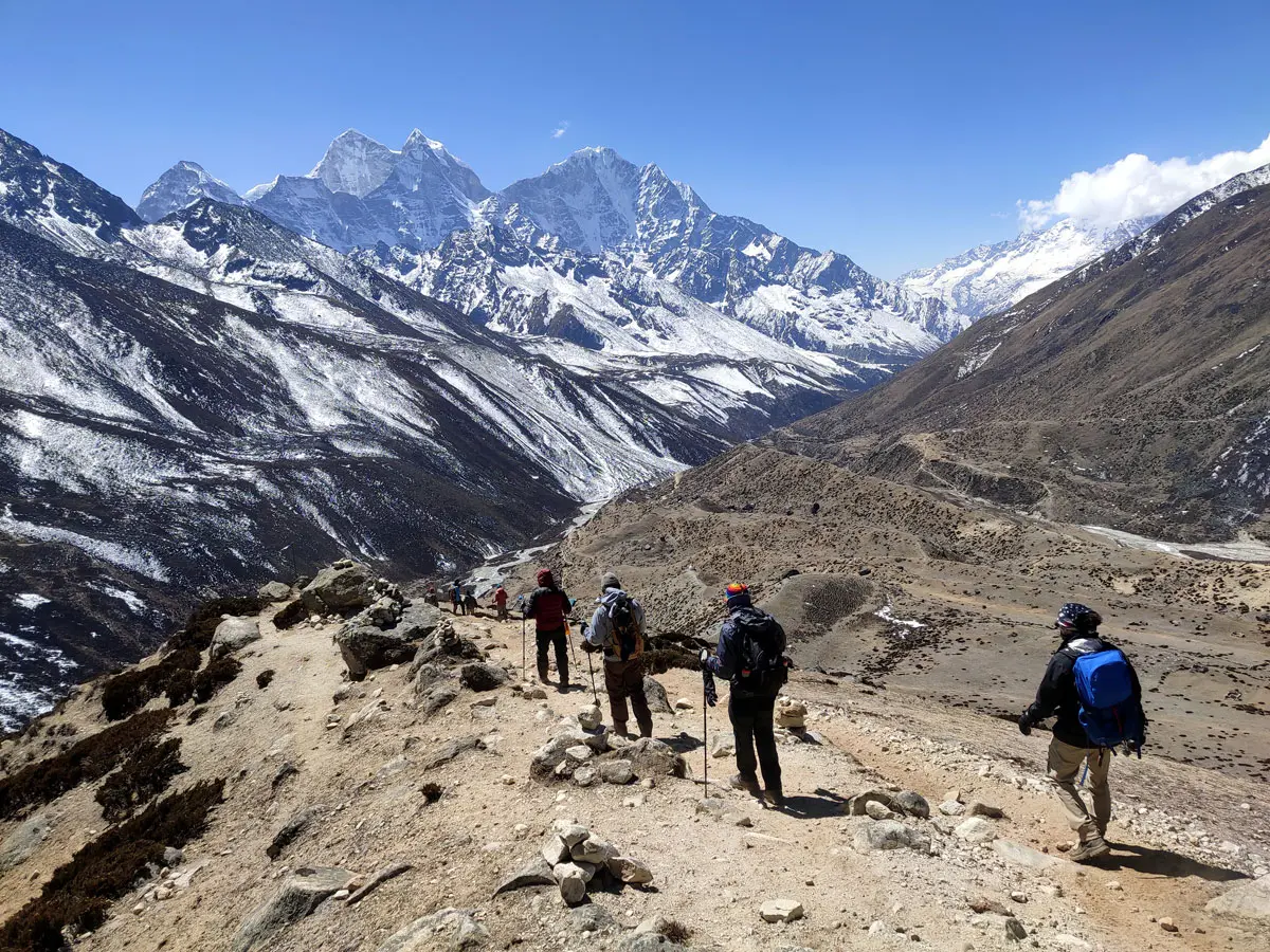 Trekkers return to Dingboche after hiking Nangkartsang Peak
