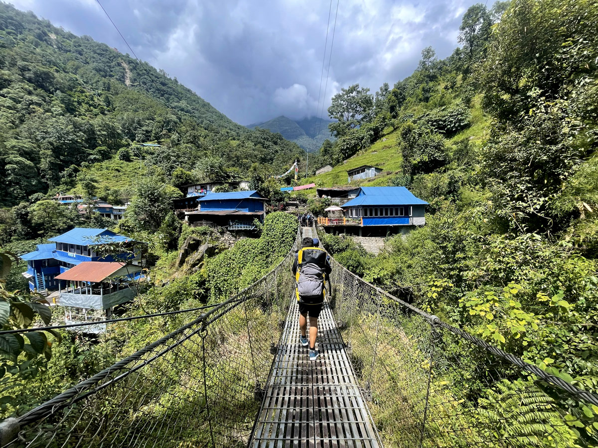 Crossing suspension bridge to Tikhedhunga