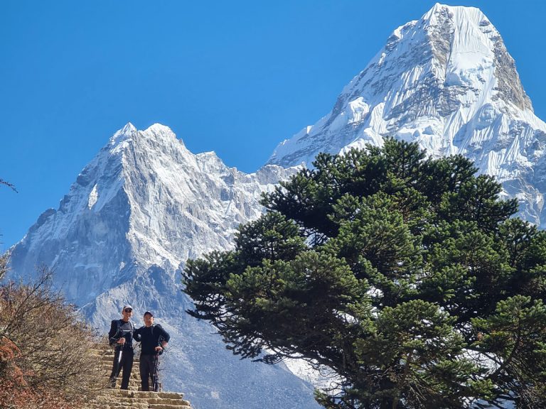 Trekkers make their way to Dingboche, with the majestic Ama Dablam in the background