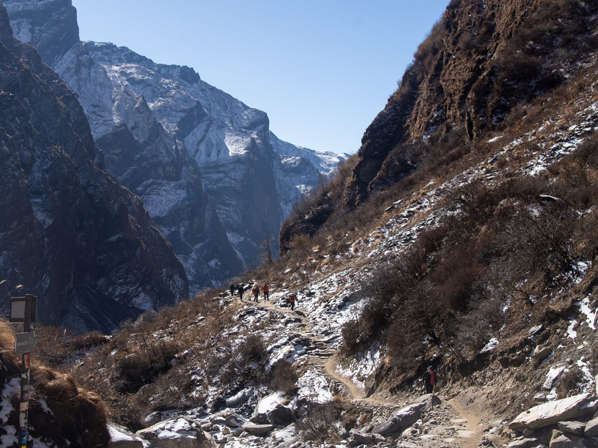 Is Annapurna Base Camp Trek Suitable for Beginners? 4 Trekkers approaching Machhapuchhre Base Camp