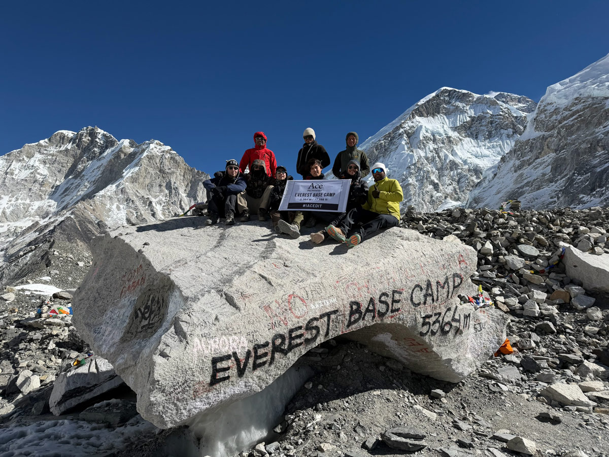 Everest Base Camp Trek Distance Guide: How Far You Walk Each Day 9 Celebration pose at Everest Base Camp