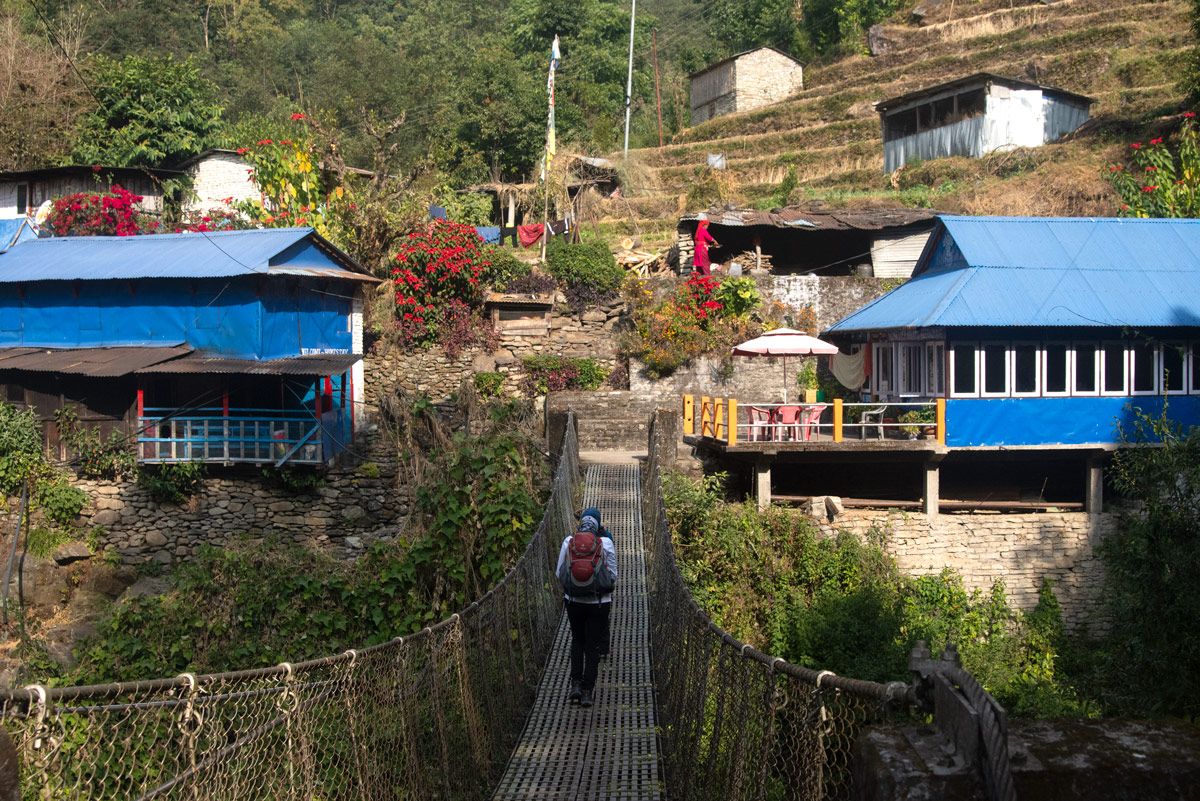 Annapurna Base Camp Trek Distance 3 Trekkers arriving at Tikhedhunga