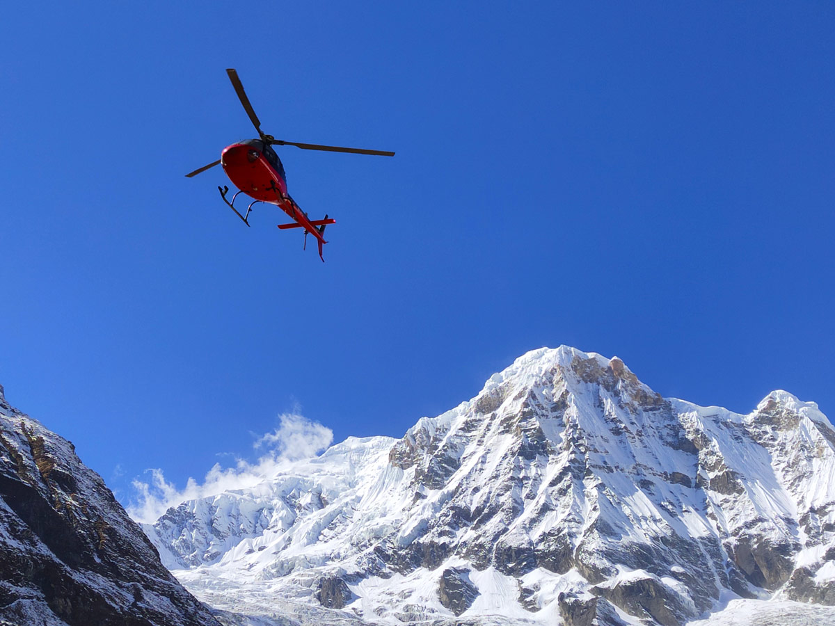 Helicopter taking off from Annapurna Base Camp Helicopter taking off from Annapurna Base Camp