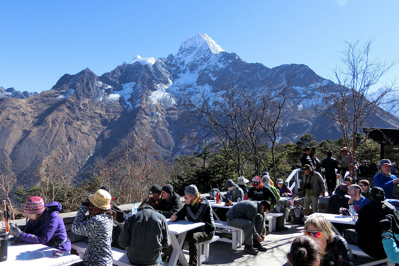 Hotel Everest View: One of the World's Highest Luxury Hotels 8 Relaxing at Hotel Everest View with Thamserku towering behind.