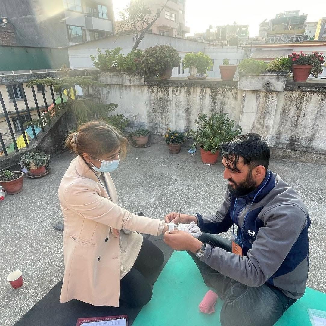 Wilderness First Aid Training at Ace the Himalaya 11 Guide Wrapping bandage in hand