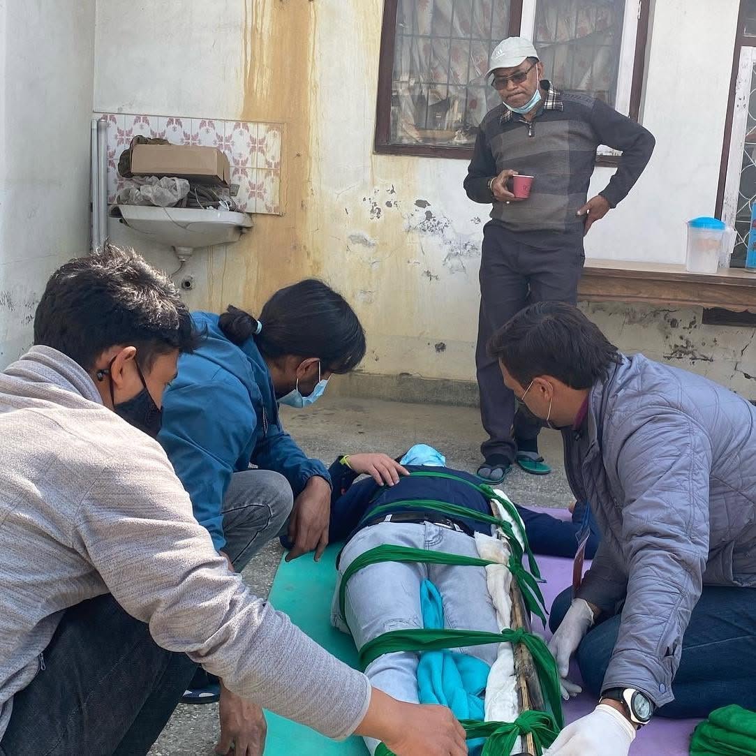 Wilderness First Aid Training at Ace the Himalaya 12 Learning to place injured trekker in stretcher