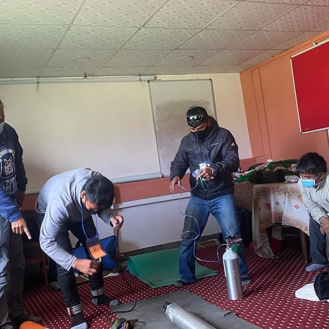 Wilderness First Aid Training at Ace the Himalaya 13 Guides learning to set up oxygen cylinder